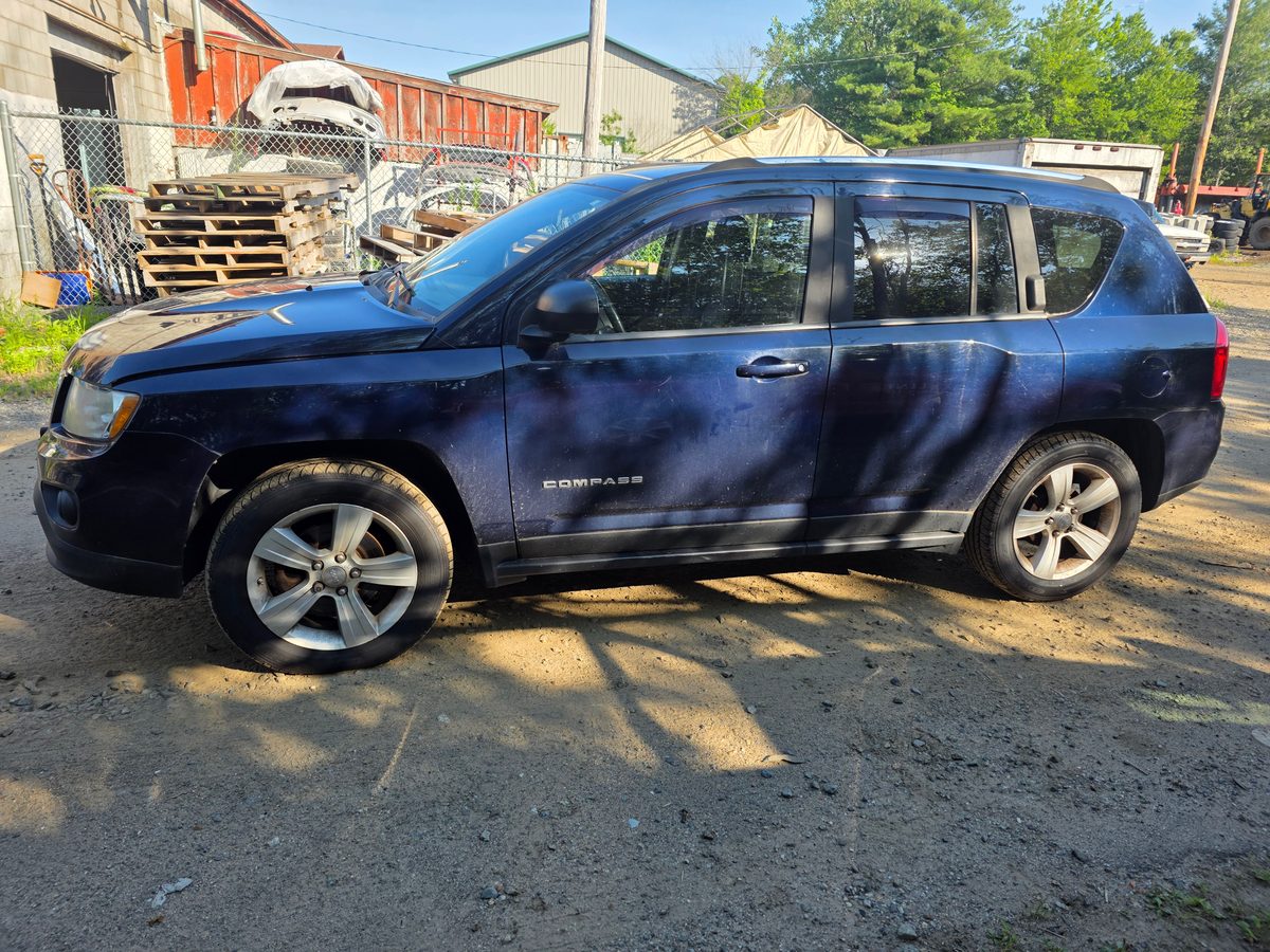 2012 Jeep Compass Latitude True Blue Pearl - front grille and headlights